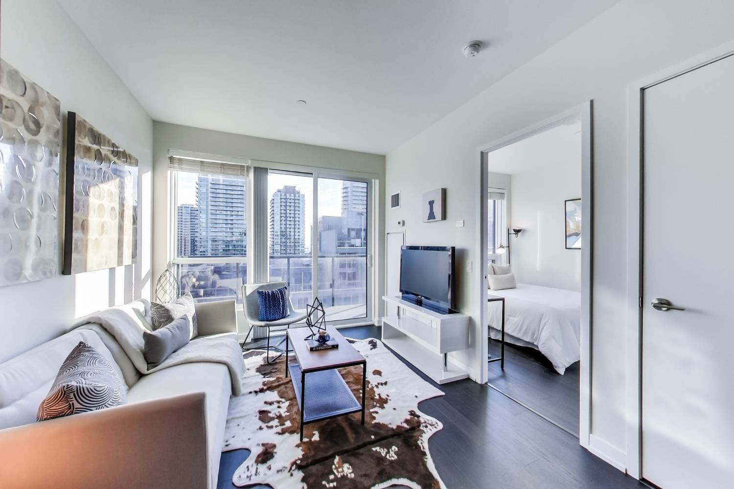 A bright, vaulted living space with a skyline view in a Toronto home sold by the team